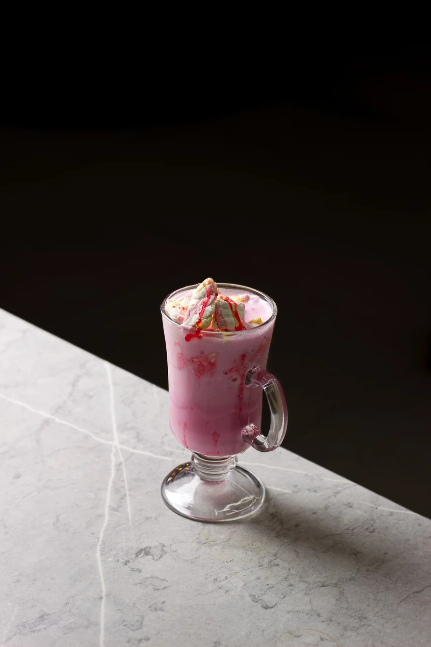 Seasonal pink berry creation with whipped cream